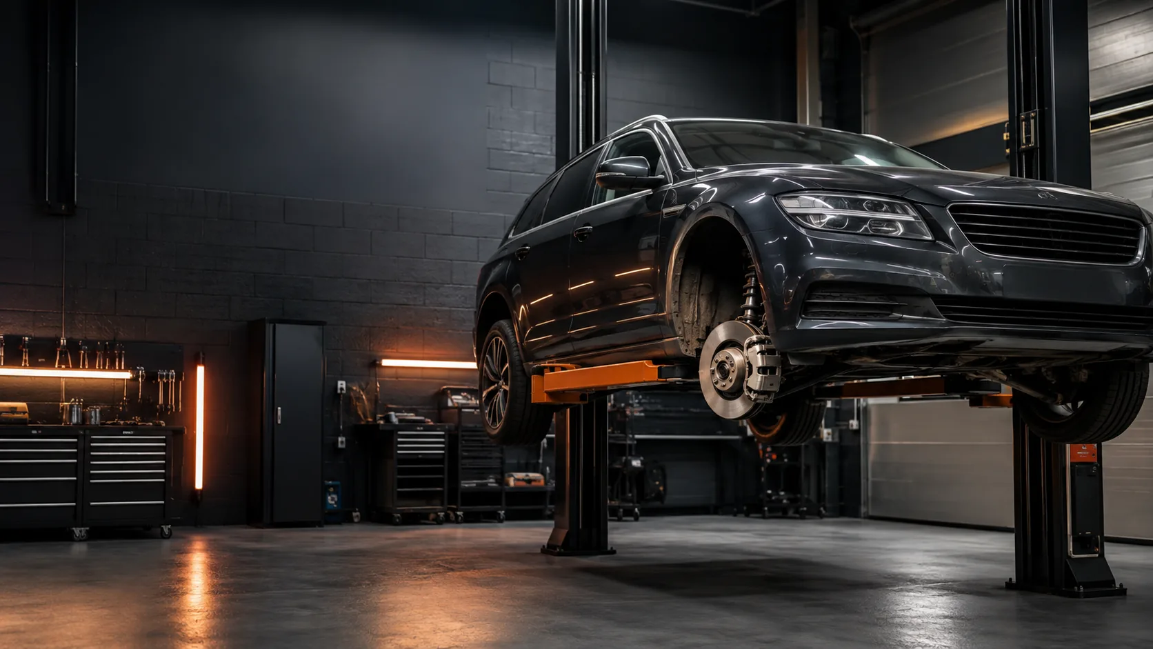 Car raised on a workshop lift for professional servicing and mechanical repair